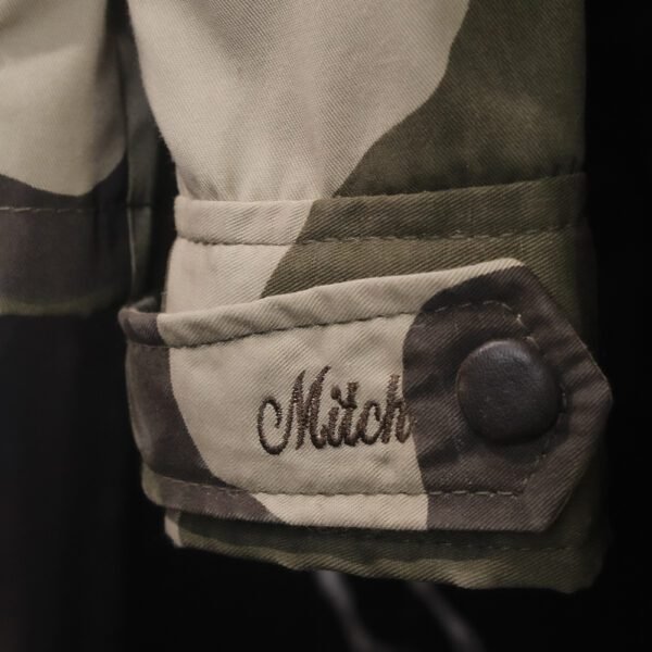 Ribbed collar detail of MITCH Luxury Bespoke Camo Jacket with premium stitching”