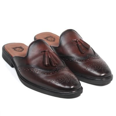 Brown handcrafted leather mule loafers with tassel detail and brogue pattern, open-back design with rubber sole by Shoe Bespoke.