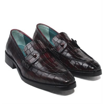 Dark burgundy croc-textured leather loafers by Shoe Bespoke with handcrafted finish, wood sole, and metal strap detailing.